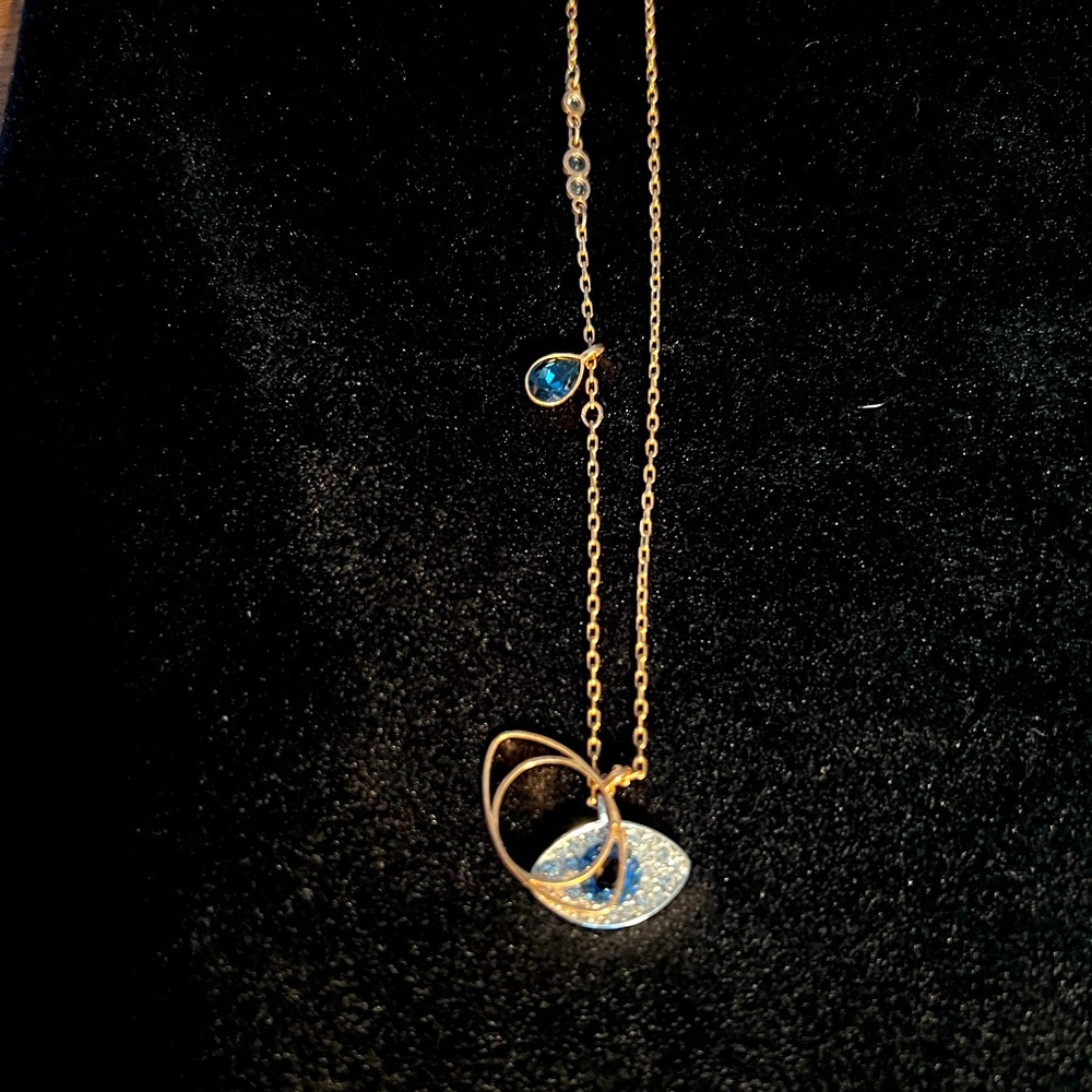 Evil eye pendant. Hangs on 8” chain